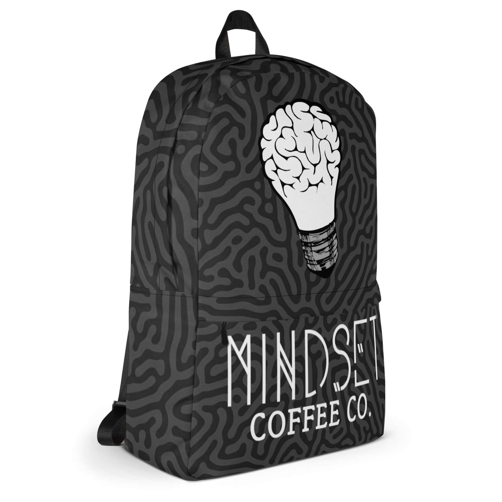 Mindset Coffee Backpack featuring a brain-shaped lightbulb design on a stylish black pattern.