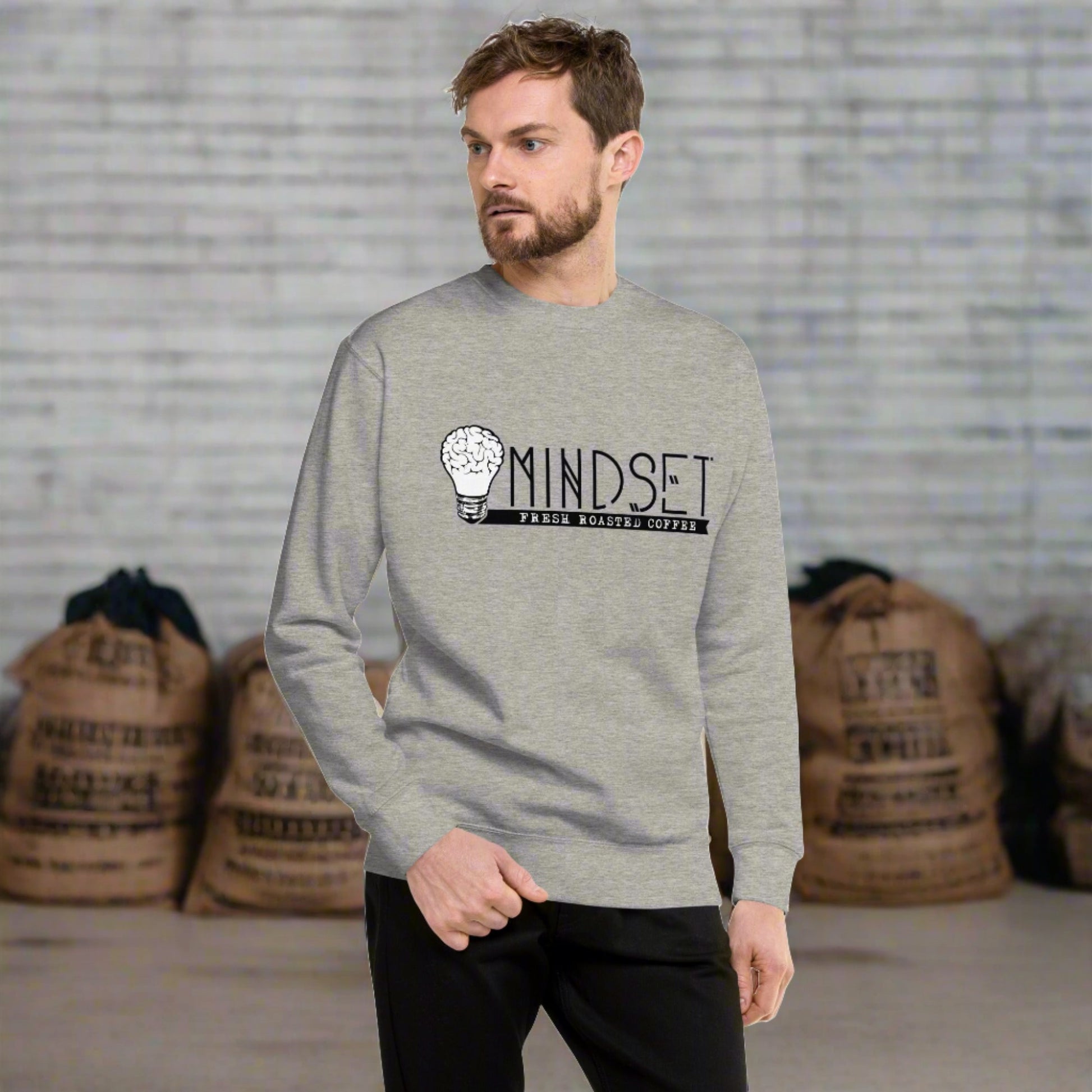 man wearing grey mindset coffee shirt